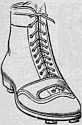 A leather lace-up boot with two studs visible at the toe